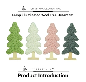 Close-up of wool felt Christmas trees with woven texture and light wood bases