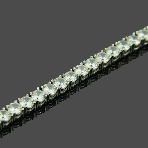 Macro detail of 5mm silver tennis bracelet with sparkling micro-pave cubic zirconia stones