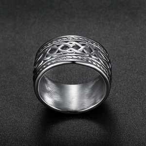 Detailed close-up of heavy stainless steel Celtic knot ring with intricate woven patterns