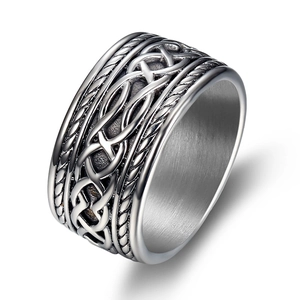 Detailed close-up of retro silver Celtic knot weave pattern on a heavy stainless steel ring