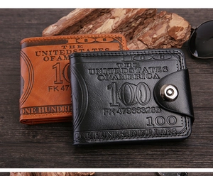 Detail of vintage bi-fold men's wallets with 100 dollar bill pattern and magnetic closure