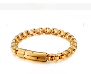 Macro detail of gold 18K vacuum plated striped cuban link chain with secure buckle