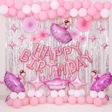 Pink themed birthday party set with flamingo balloons and silver rain curtains