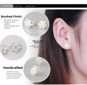 Detail view of 925 sterling silver snowflake earrings with brushed metal texture