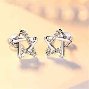 Macro shot of silver star stud earrings with half polished and half pavé zircon details