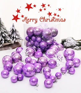 Macro shot of 37-piece purple Christmas ball ornaments in various sizes and finishes