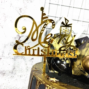 Golden acrylic Merry Christmas cake topper with mirrored finish for holiday party decoration