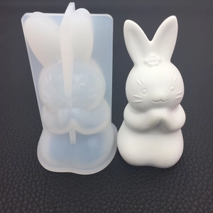 Detail view of 3D praying rabbit silicone mold with white resin bunny finished sample