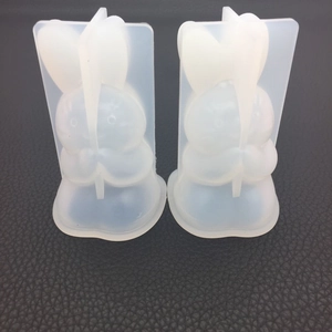 Close-up of flexible translucent silicone bunny molds for DIY candle and resin casting