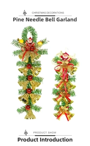 Detail of Christmas hanging swag with green pine needles, gold bells and Santa figurines