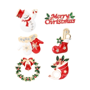 Christmas brooch set with snowman and festive motifs in red green and gold enamel finish
