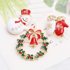 Three-piece Christmas enamel brooch set with snowman, wreath and gloves in festive colors