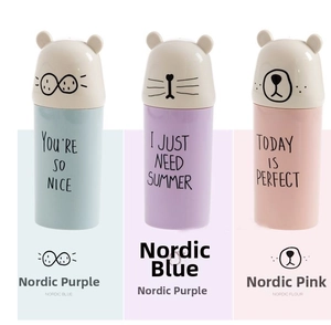 Close-up of portable cartoon wash cups in Nordic blue, purple, and pink with cute ear lids