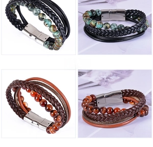 Macro detail of multi-layer leather bracelets with natural stone beads and magnetic clasp