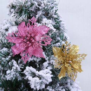 10cm pink and gold hollow Christmas flowers with glitter on snow-covered pine tree