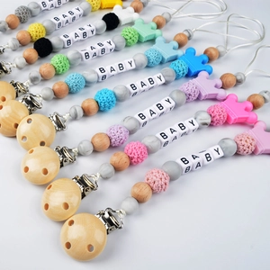 Pacifier clips with silicone beads, wooden clips and crown teether in various colors