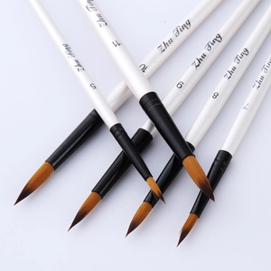Set of 5 pearl white pointed watercolor brushes with orange nylon bristles on white background