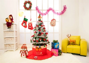 Close-up of non-woven Christmas tree base box with snowman and festive ornaments
