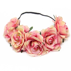 Detail of faux pink and yellow gradient roses on a black elastic headband for wedding
