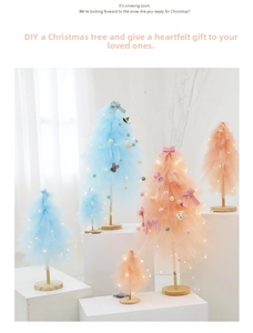 DIY tulle Christmas tree with LED lights and mini ornaments on a wooden base