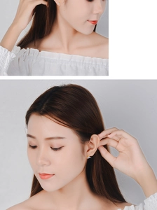 Close-up of model wearing small colorful bird stud earrings in polished enamel finish