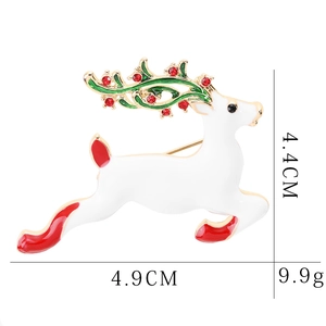 Detail view of a white enamel reindeer brooch with colorful gems and size dimensions