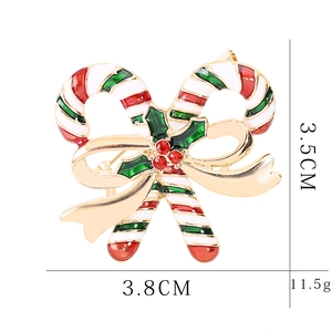 Detailed view of Christmas candy cane brooch with dimensions 3.8cm width and 11.5g weight