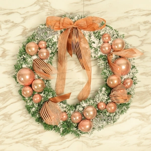 Christmas wreath with flocked rose gold ornaments and silver Merry Christmas sign