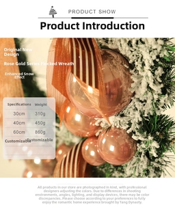 Detail of rose gold ornaments and snowy pine needles on Christmas wreath available in 3 sizes