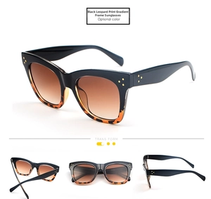 Detail view of cat eye sunglasses with black leopard gradient frame and tinted lenses