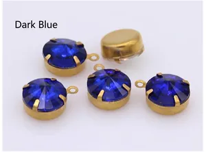 Close-up of dark blue crystal round pendant with gold claw setting for DIY jewelry
