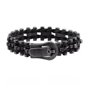 Macro view of vintage punk bracelet featuring skull relief and belt buckle clasp