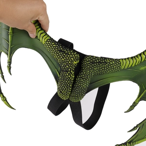 Detail of green dragon wings with scale texture and elastic straps for kids costume