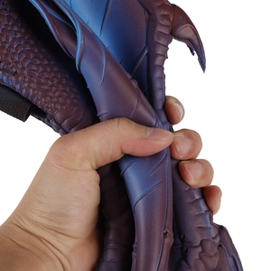 Detail of blue purple gradient dragon wings showing flexible foam material and scale texture