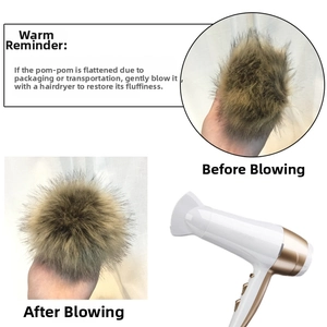 Detail showing faux fur pom pom being restored to fluffy state with a hair dryer