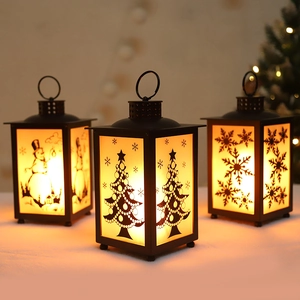 Black Christmas lantern with LED flame patterns of snowman, tree and snowflake