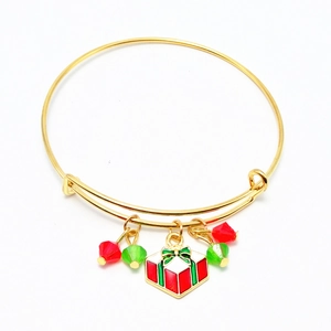 Detail of Christmas stretch bracelet with gold plating, enamel gift box charm and beads