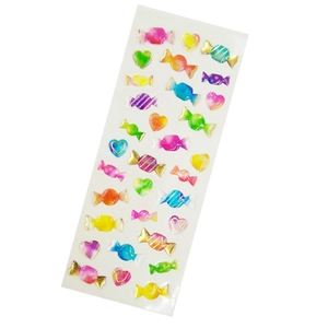 Colorful crystal epoxy stickers with gold trim in candy and heart shapes on white back