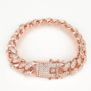 Detailed shot of 12mm rose gold Cuban link bracelet with full diamond pavé and box clasp