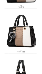 Detail view of tri-color faux crocodile leather tote with plush ball and gold hardware