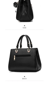 Side and back view of black lychee leather handbag with fox hardware and pompom
