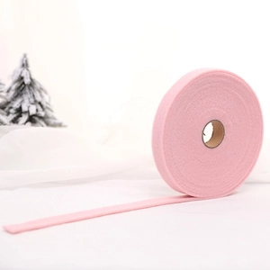 Pink wool felt ribbon roll for Christmas DIY crafts and festive wreath decorations