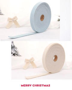 Detailed macro view of soft wool felt ribbons in light blue and beige for DIY Christmas decor