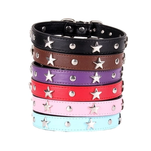 Stack of colorful leather pet collars with silver star studs and round metal rivets