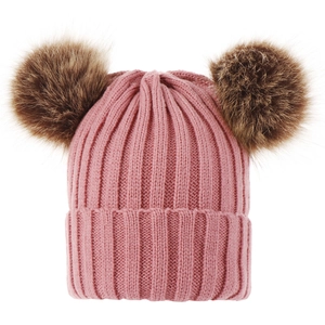 Detail of pink knitted baby hat featuring two large brown faux fur pom poms on top
