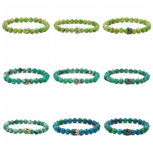 Nine variants of 8mm lava rock and matte stone beaded bracelets with crown charms