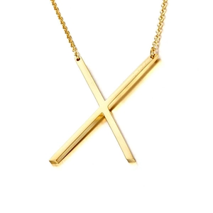 Detailed view of large gold letter X pendant with polished mirror finish on thin chain