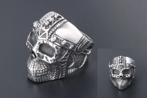 Macro view of silver punk skull ring with intricate gothic textures and helmet details