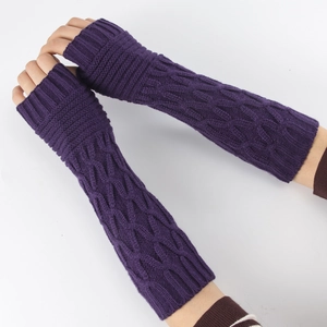 Detail of purple cable-knit arm warmers with thumb holes for winter fashion