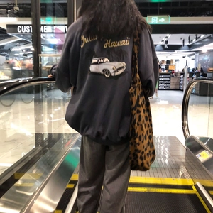 Navy crewneck sweatshirt with retro car back print and leopard print tote bag